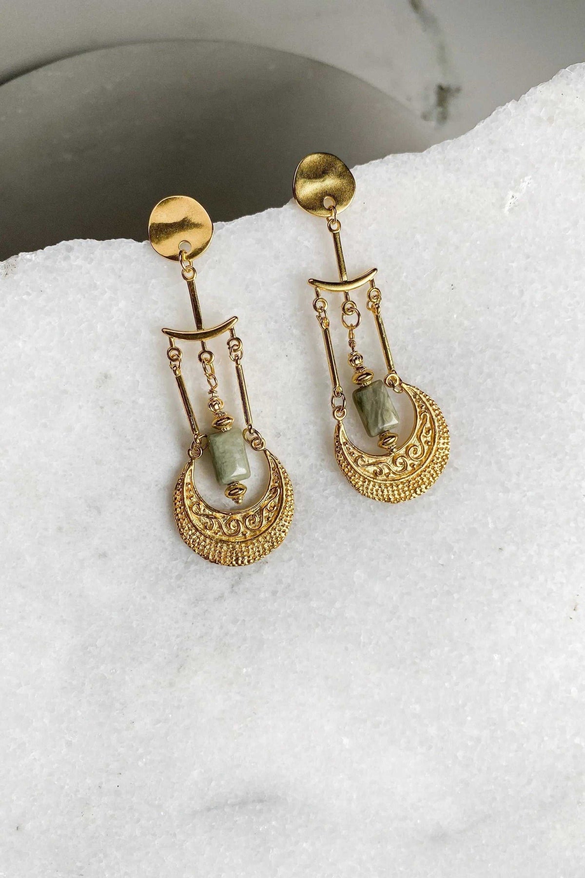 Statement Boho Earrings in gold-tone metal with green stones, ornate textured drop and dangling chain details