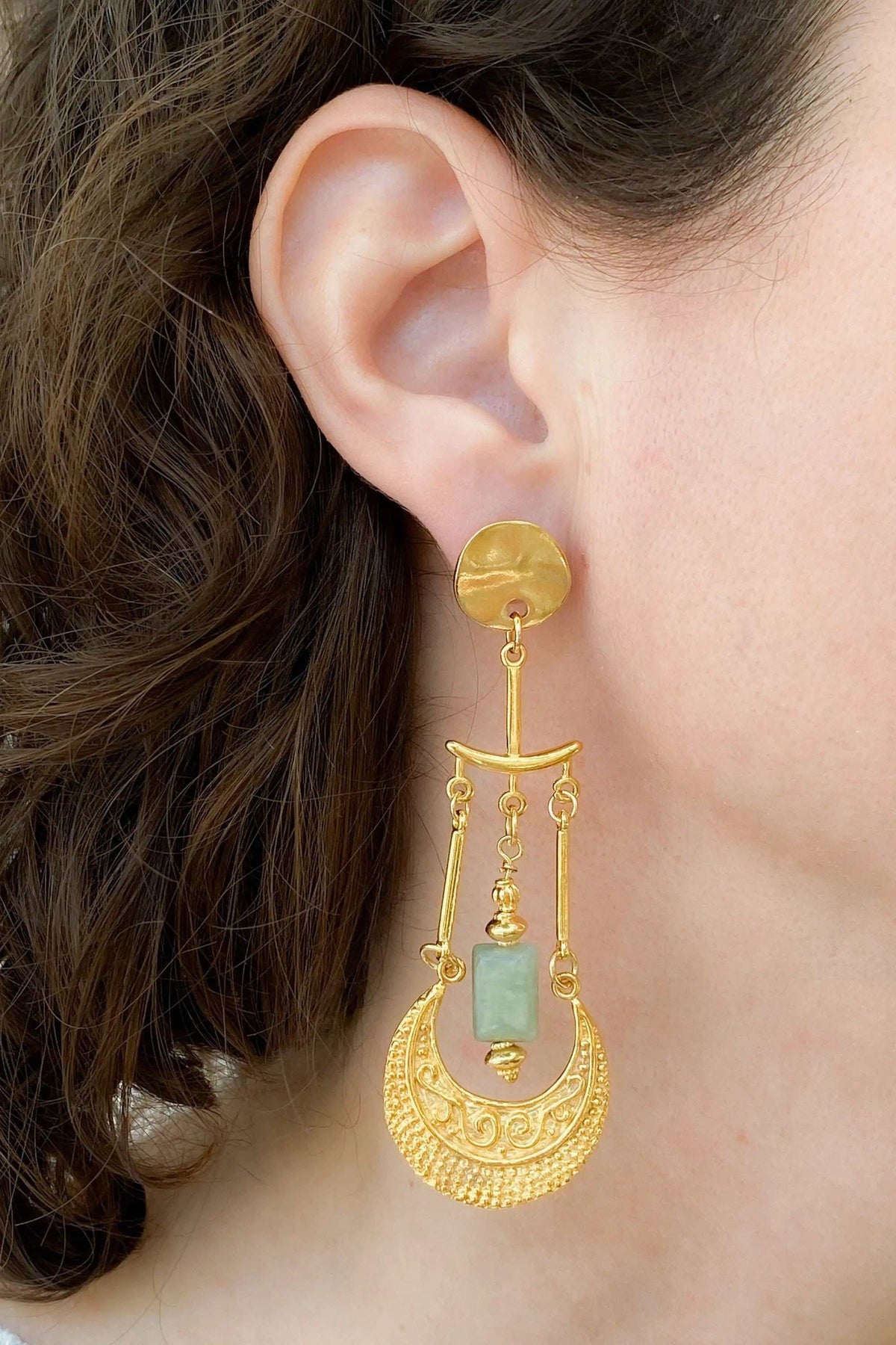 Statement Boho Earrings in gold-tone metal with green stone, ornate crescent design and dangling chains