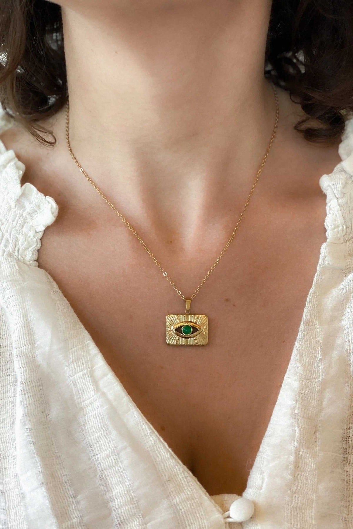 TAMA NECKLACE gold-filled chain necklace with rectangular gold evil eye pendant and green center