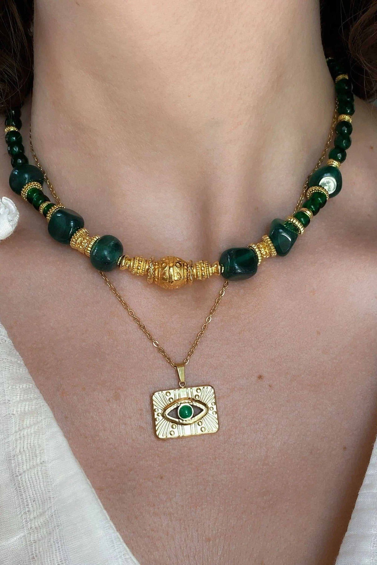 TAMA NECKLACE, gold-filled chain with green beads, textured gold accents, and rectangular evil eye pendant