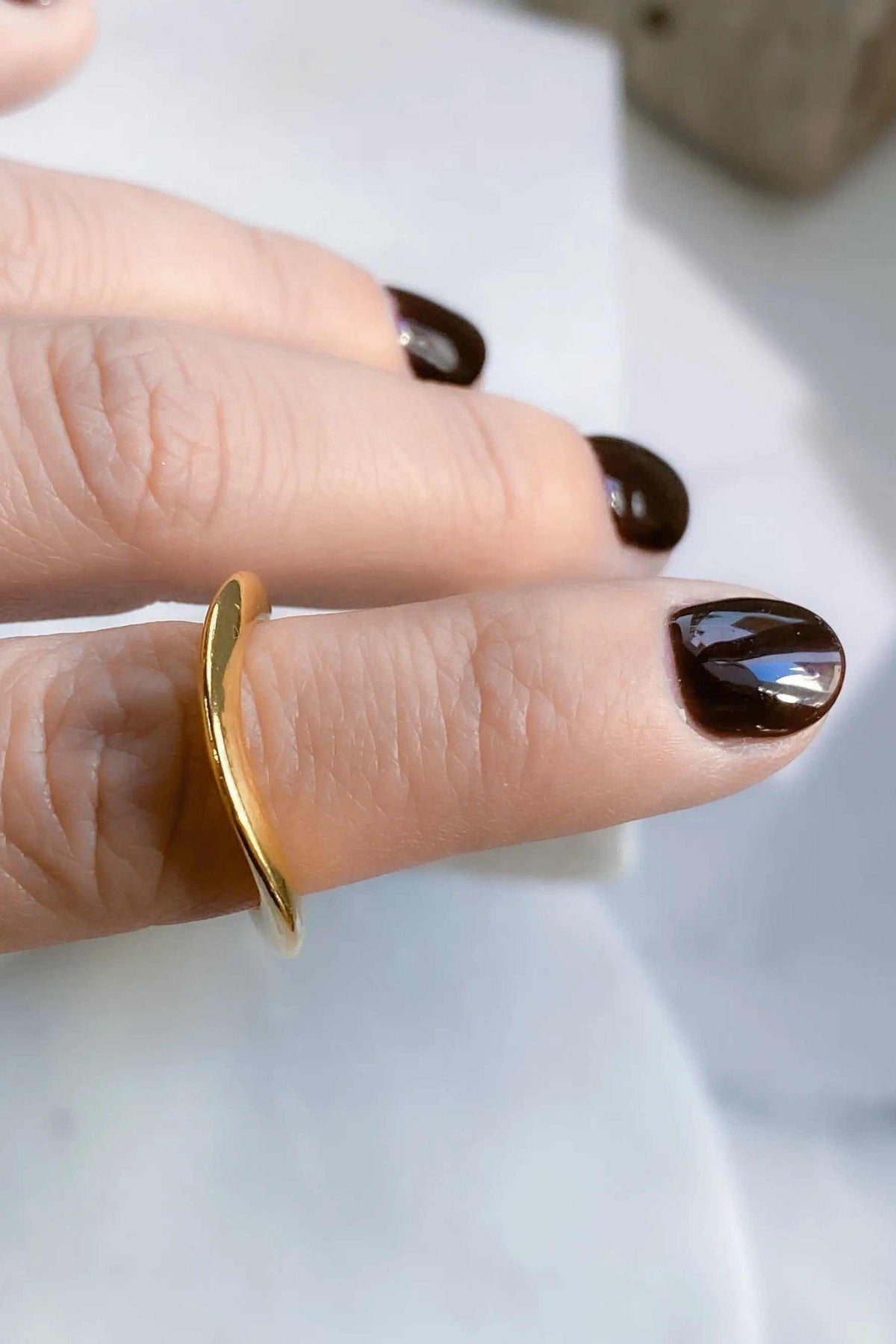 Thick Gold Band ring in a polished gold-tone finish, with a smooth, curved narrow band and open adjustable shape.