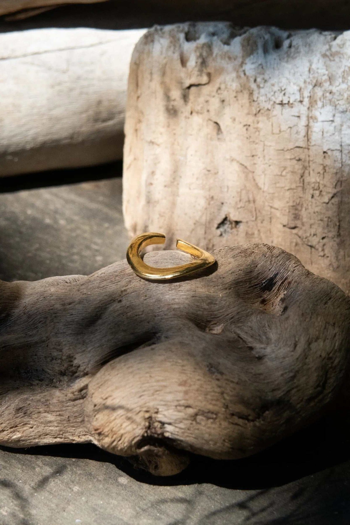 Thick Gold Band ring in polished gold-tone metal, with a broad rounded band and open adjustable ends