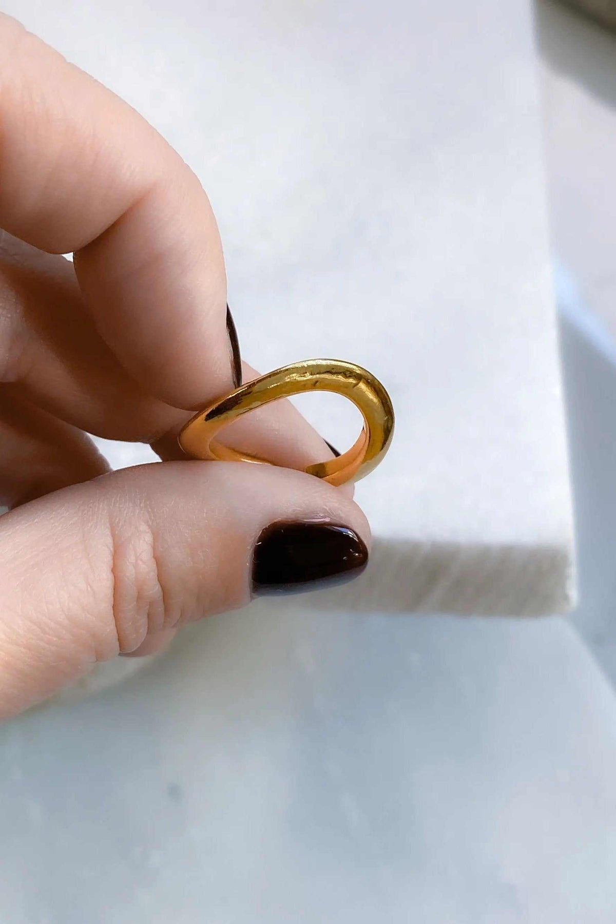 Thick Gold Band ring in polished gold-tone metal, with a broad rounded band and smooth sculptural shape