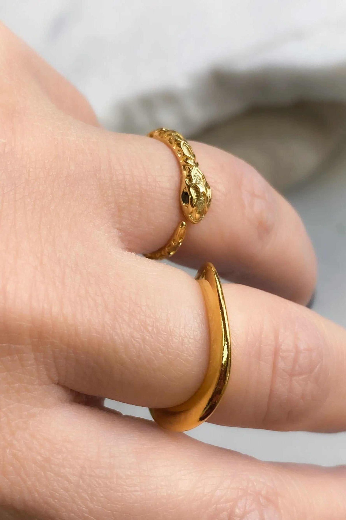Thick Gold Band ring in polished gold-tone metal, with a smooth wide band and an open, slightly adjustable shape