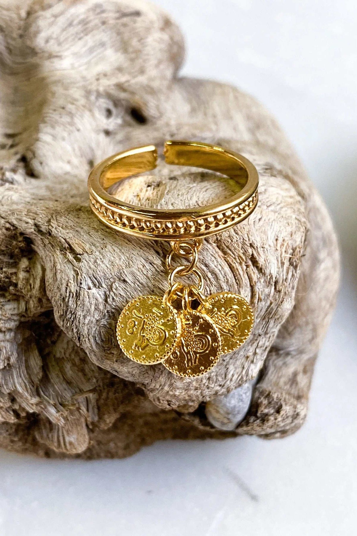 tiny coins ring in gold-tone metal with an adjustable band, textured detailing and dangling embossed coin charms