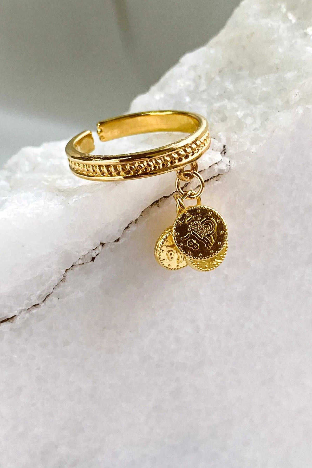 tiny coins ring in gold-tone metal with a braided band and dangling embossed coin charms
