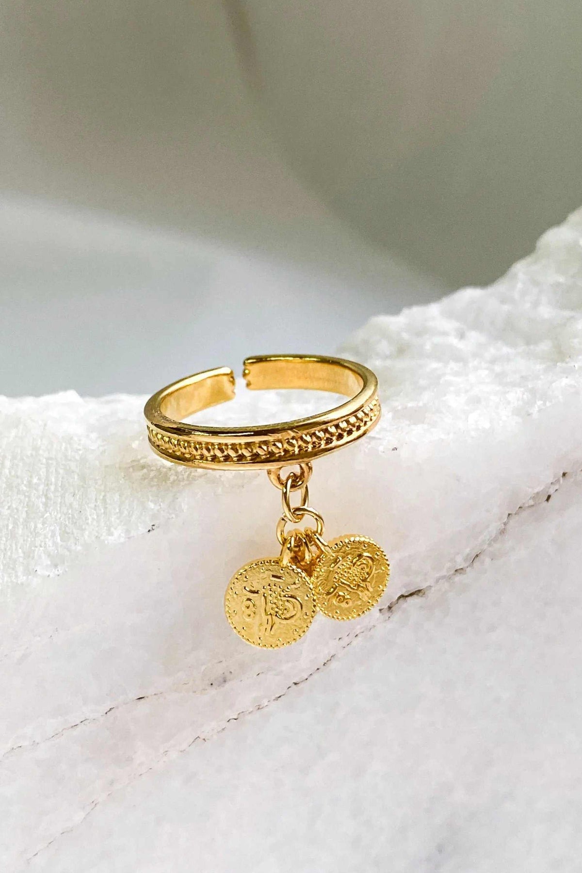 tiny coins ring in gold-tone metal, with a textured adjustable band and two dangling round coin charms
