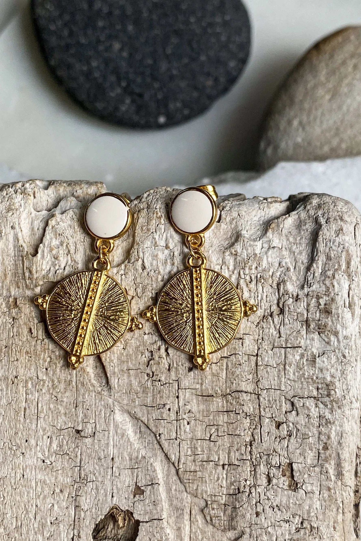 White Gold Boho earrings with gold-tone geometric sunburst pendants, white circular studs, and fine etched details