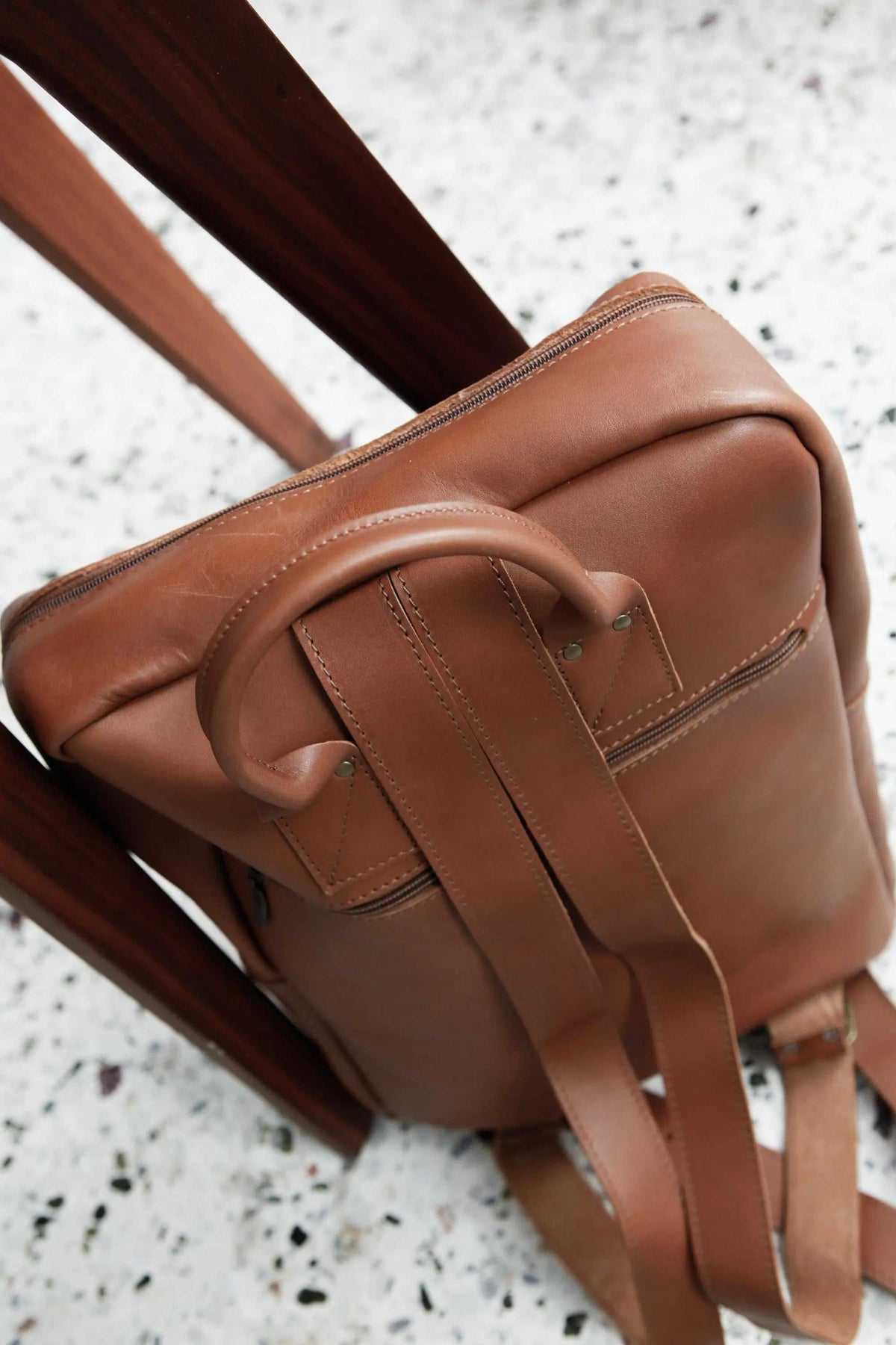 XLARGE BACKPACK leather rucksack in warm brown with a smooth finish, adjustable straps and a large flap-front pocket