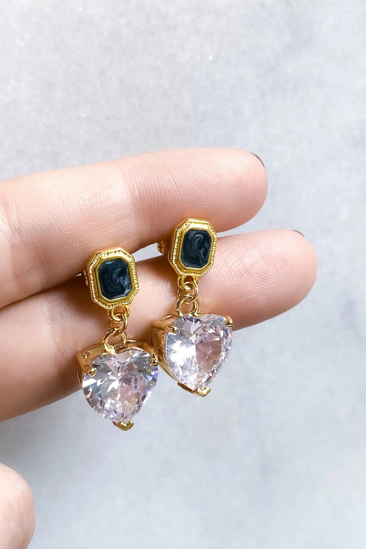 Zircon Heart Earrings with clear faceted heart drops, black oval studs and gold-tone settings