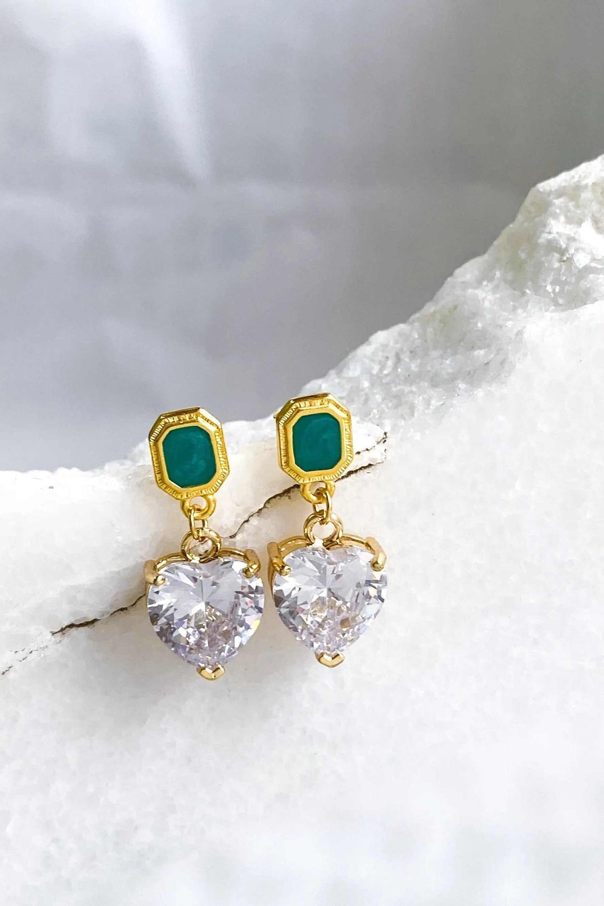 Zircon Heart Earrings with clear heart-shaped stones, gold-tone settings and deep green rectangular stud tops