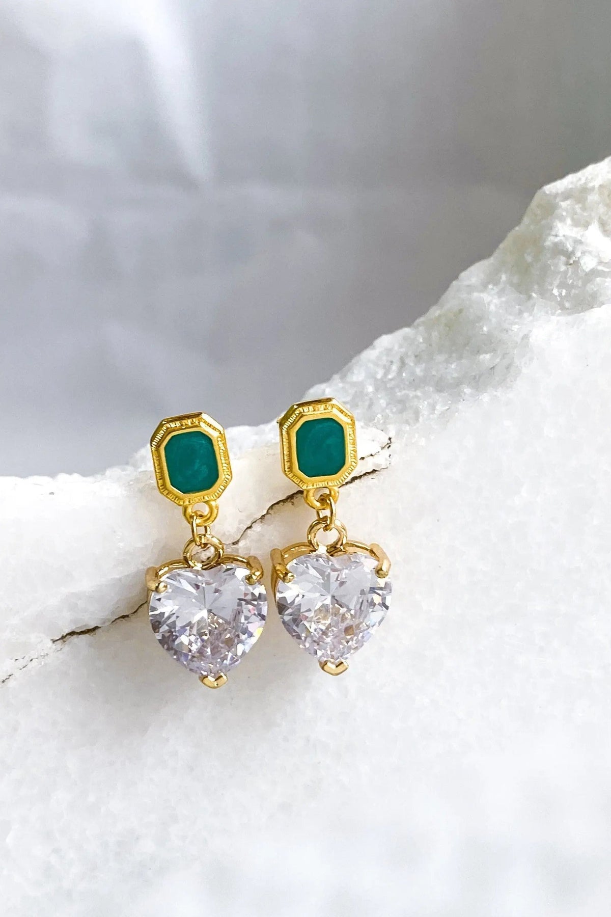 Zircon Heart Earrings with gold-tone settings, emerald-green rectangular studs, and clear faceted heart-shaped drops