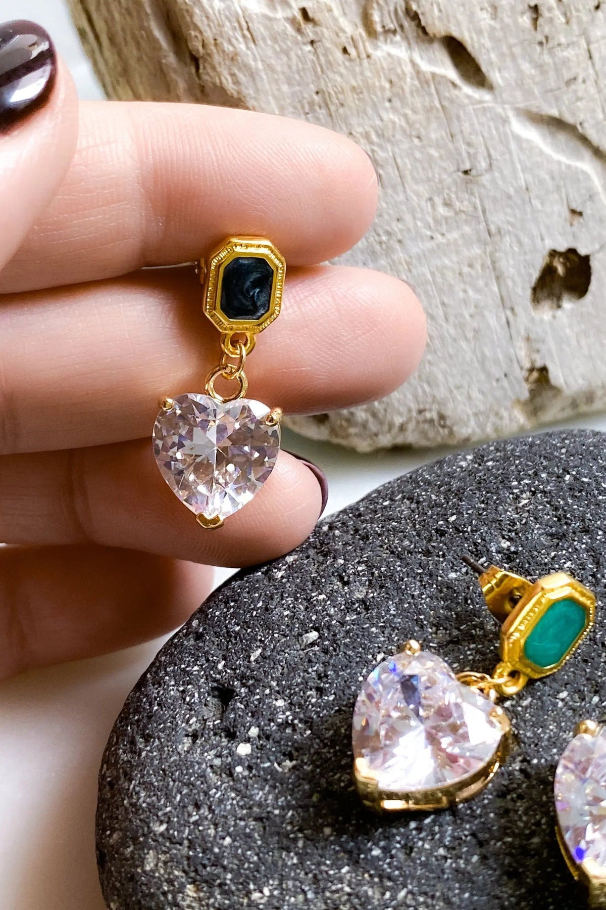 Zircon Heart Earrings with gold-tone settings, black and green rectangular studs, and clear faceted heart-shaped drops