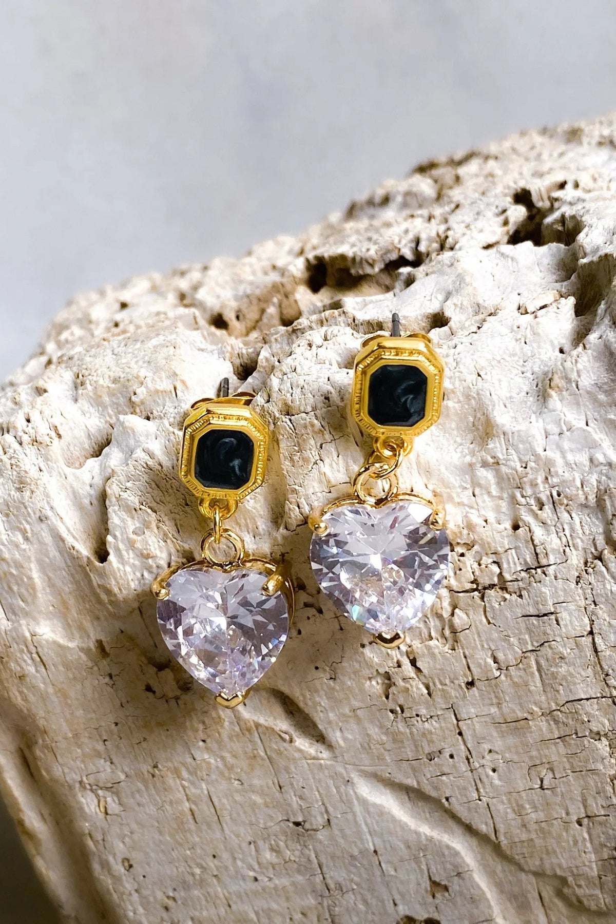 Zircon Heart Earrings with gold-tone geometric studs, black center stones, and faceted pale lavender heart-shaped drops